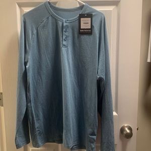 Born primitive men’s Heritage Henley in the color Cerulean.